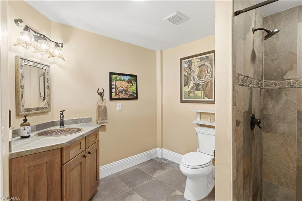 3800 Staley Road Fort Myers, FL 33905 - Photo 37 of 50 a bathroom with a granite countertop sink toilet and shower