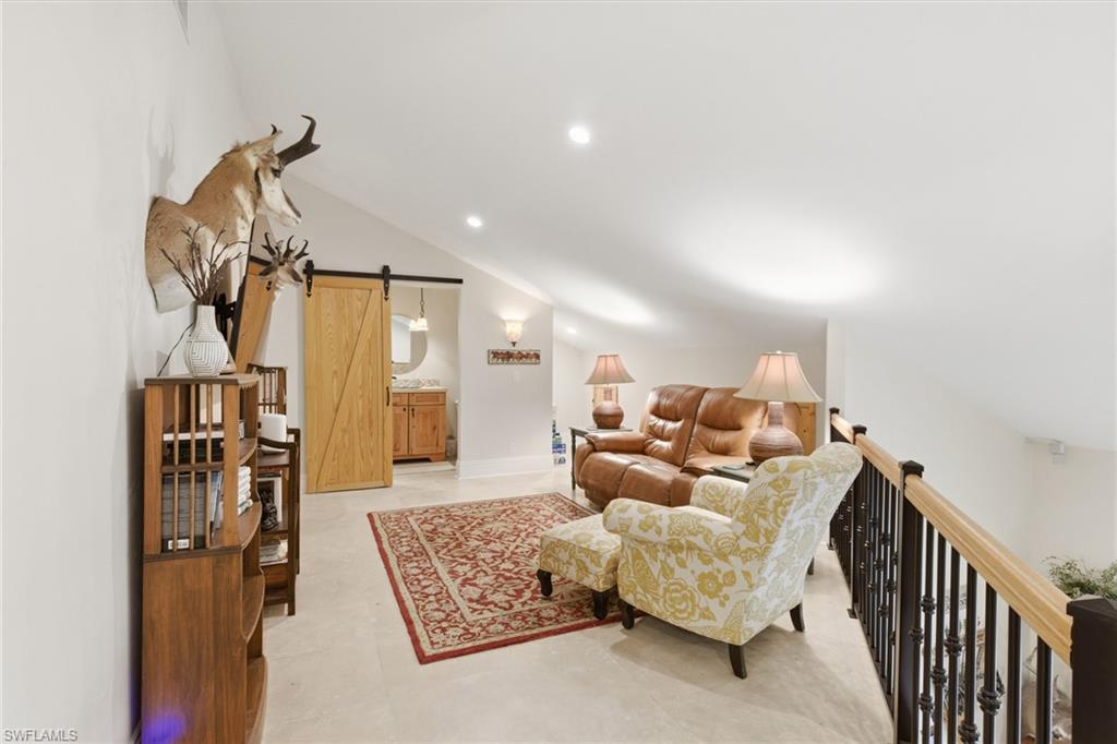 3800 Staley Road Fort Myers, FL 33905 - Photo 39 of 50 a living room with furniture and a chandelier