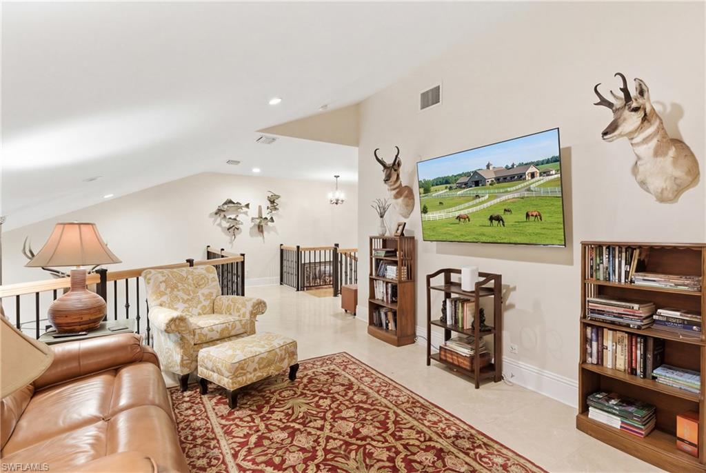 3800 Staley Road Fort Myers, FL 33905 - Photo 40 of 50 a living room with furniture and a flat screen tv