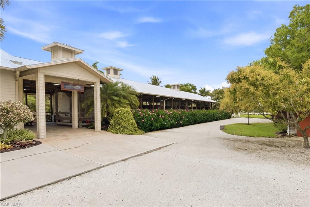 3800 Staley Road Fort Myers, FL 33905 - Photo 9 of 50 a view of a house with a yard and potted plants