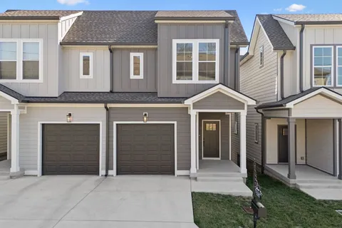 a front view of a house with a garage