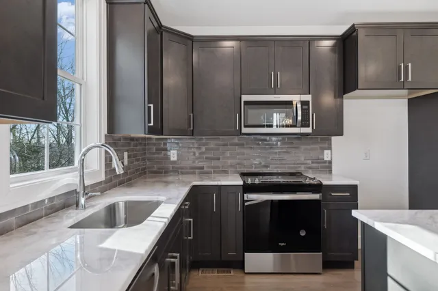 a kitchen with a stove and a sink