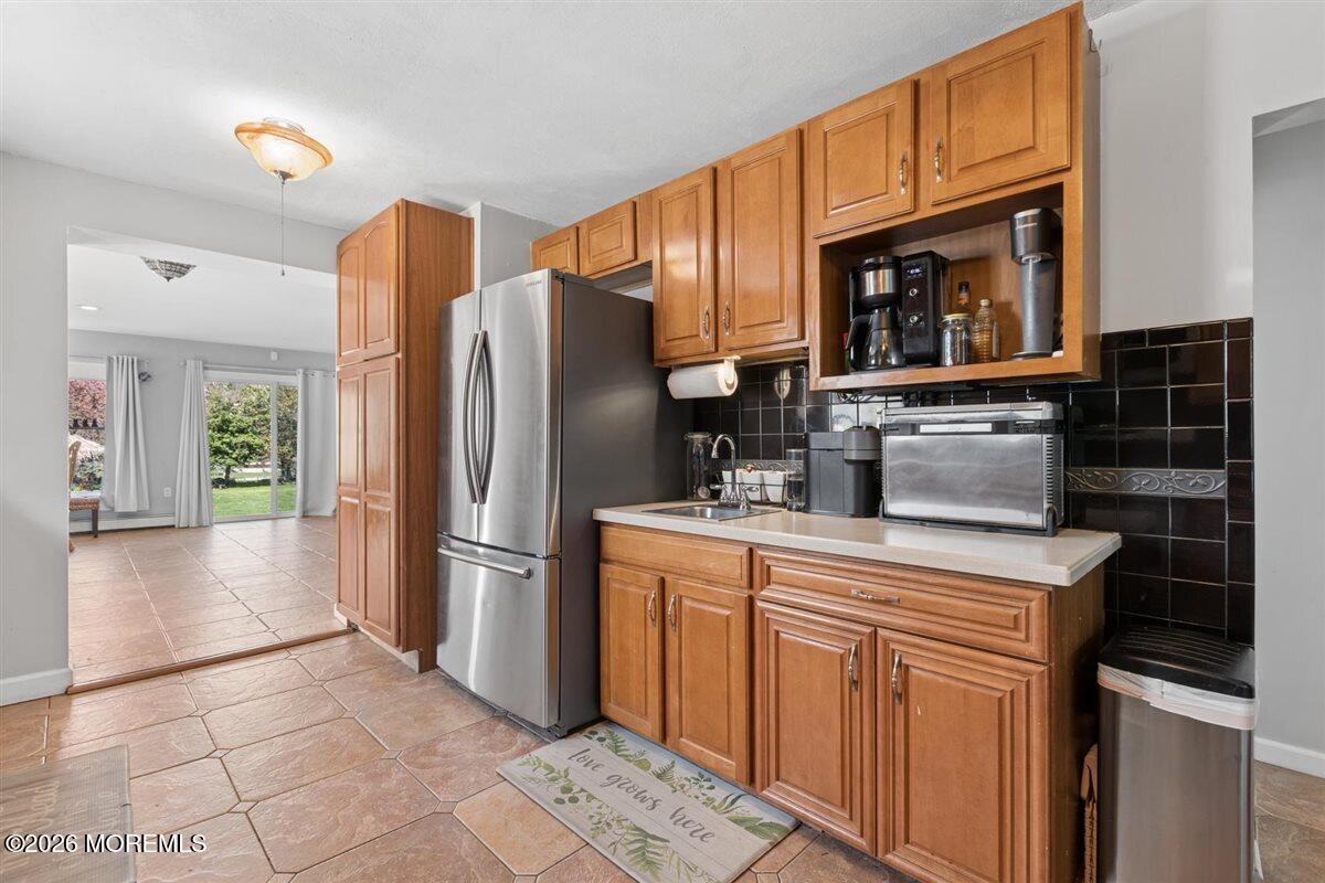 436 Cook Road Jackson, NJ 08527 - Photo 9 of 44 a kitchen with stainless steel appliances granite countertop a refrigerator stove and microwave