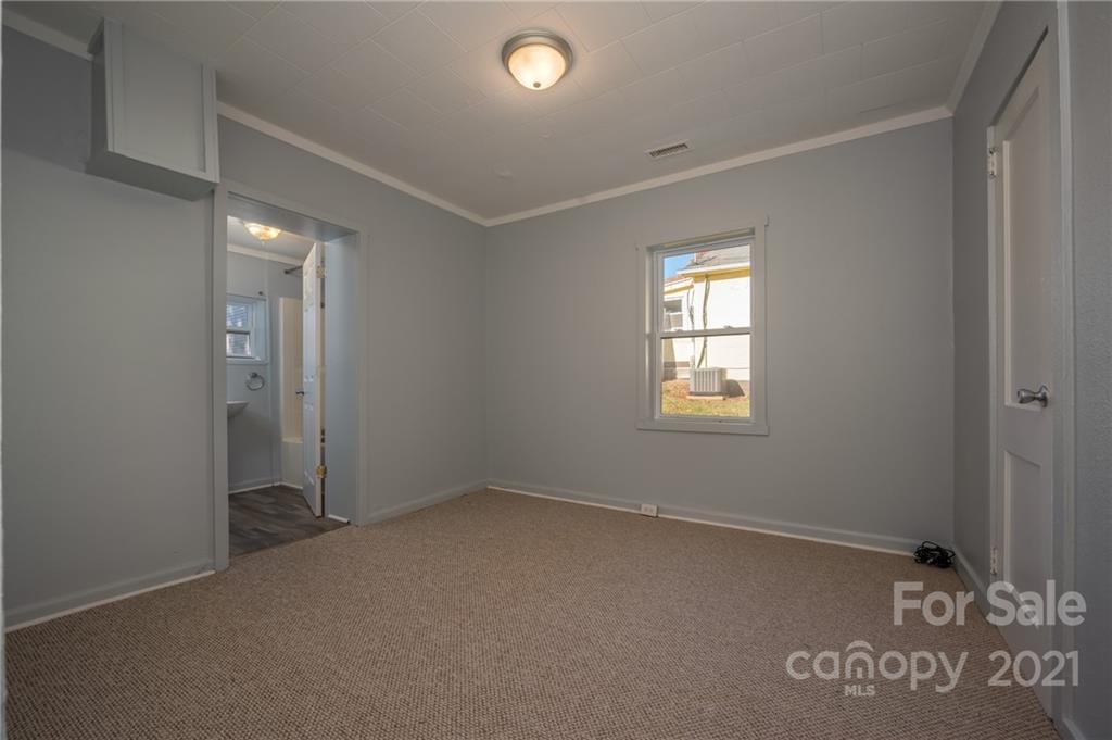 135 North Ridgecrest Avenue Rutherfordton, NC 28139 - Photo 11 of 18 an empty room with windows
