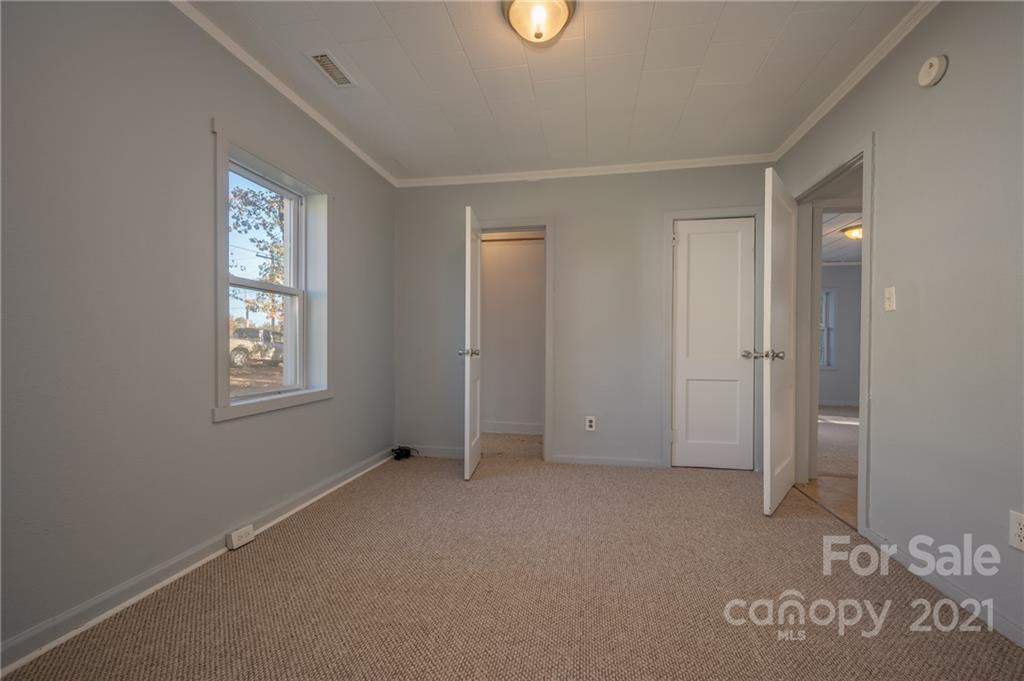 135 North Ridgecrest Avenue Rutherfordton, NC 28139 - Photo 12 of 18 a view of an empty room with windows and closet