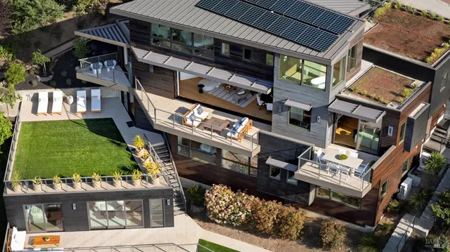 a living room with furniture a rug and a table