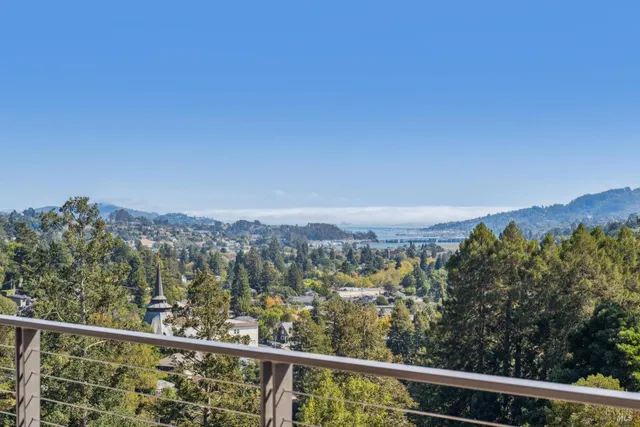 a view of a livingroom with furniture and staircase