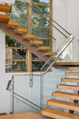 a kitchen with a potted plant on the counter and cabinets
