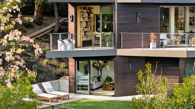a view of a livingroom with workspace and a window
