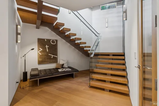 a spacious bathroom with a double vanity sink and a mirror