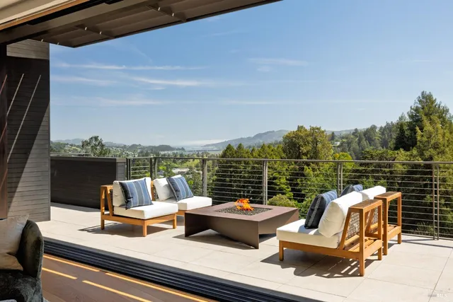 a living room with a large window and table
