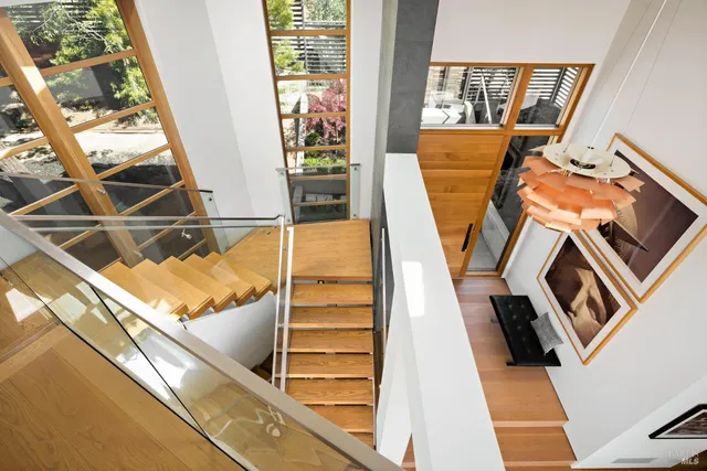 a view of a patio with table and chairs and potted plants