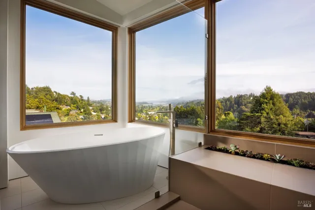 a bathroom with a granite countertop sink toilet and mirror