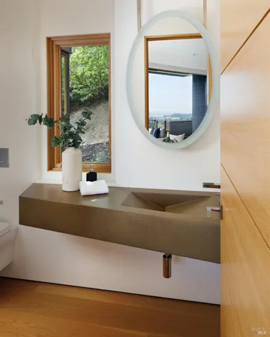 a bathroom with a bathtub and a sink