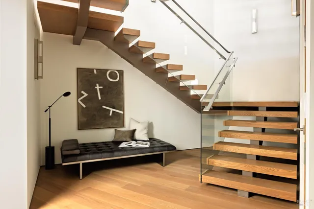 a view of a brick building with large windows