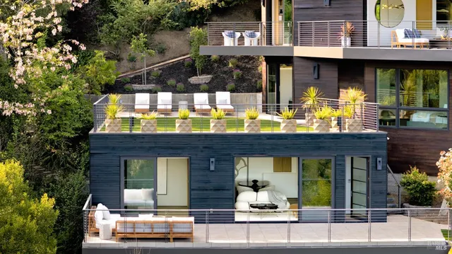 a front view of residential houses with yard