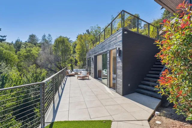 an outdoor space with seating area and garden