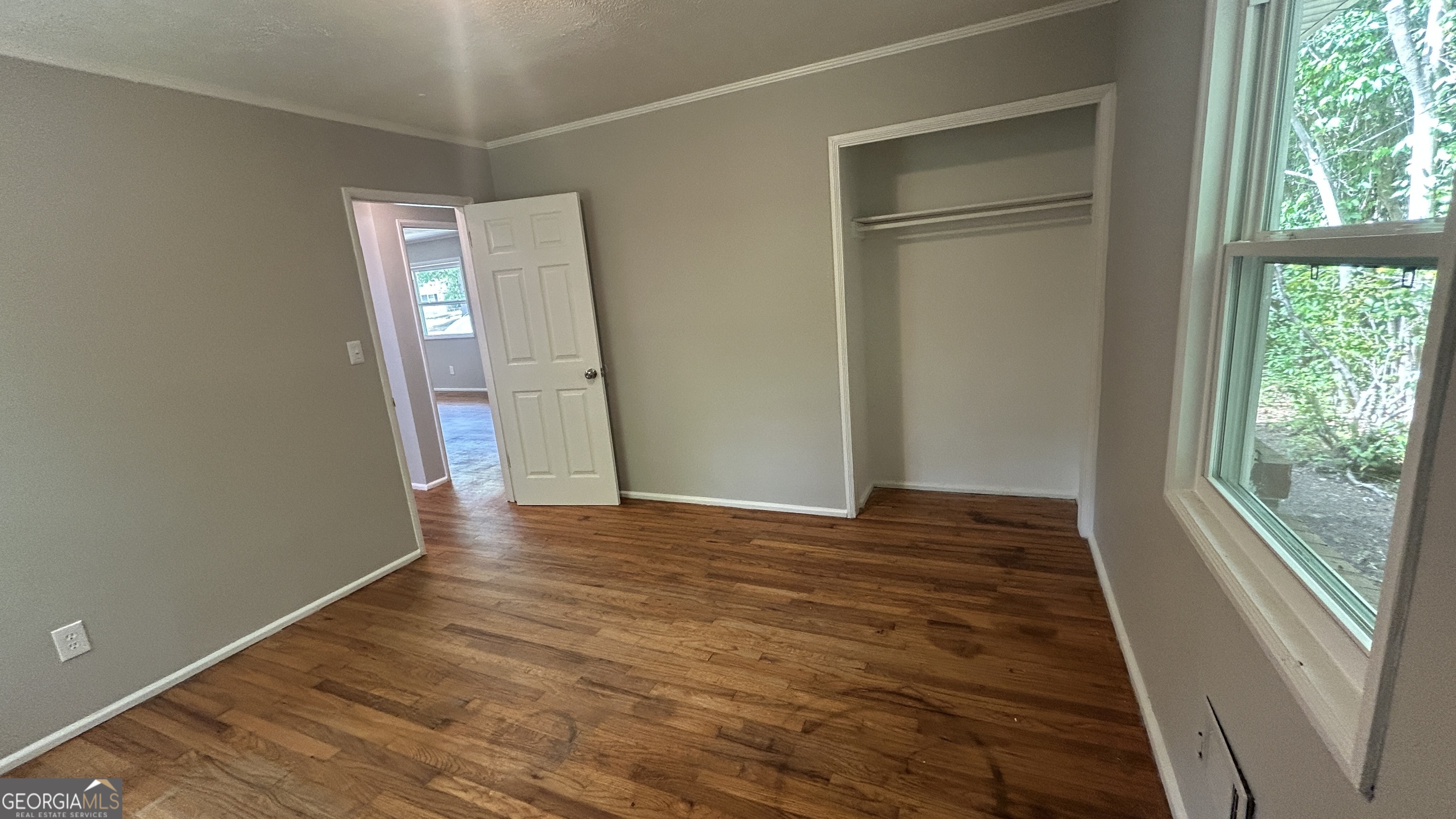 2552 Allan Way Macon, GA 31206 - Photo 10 of 14 a view of an empty room with wooden floor and a window