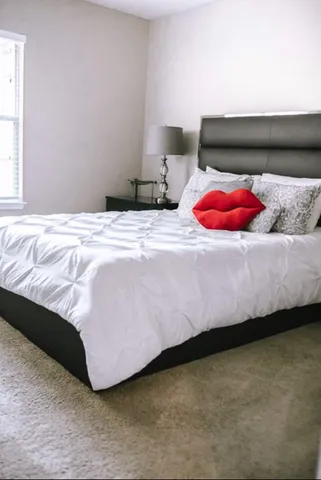 a bedroom with a bed and closet