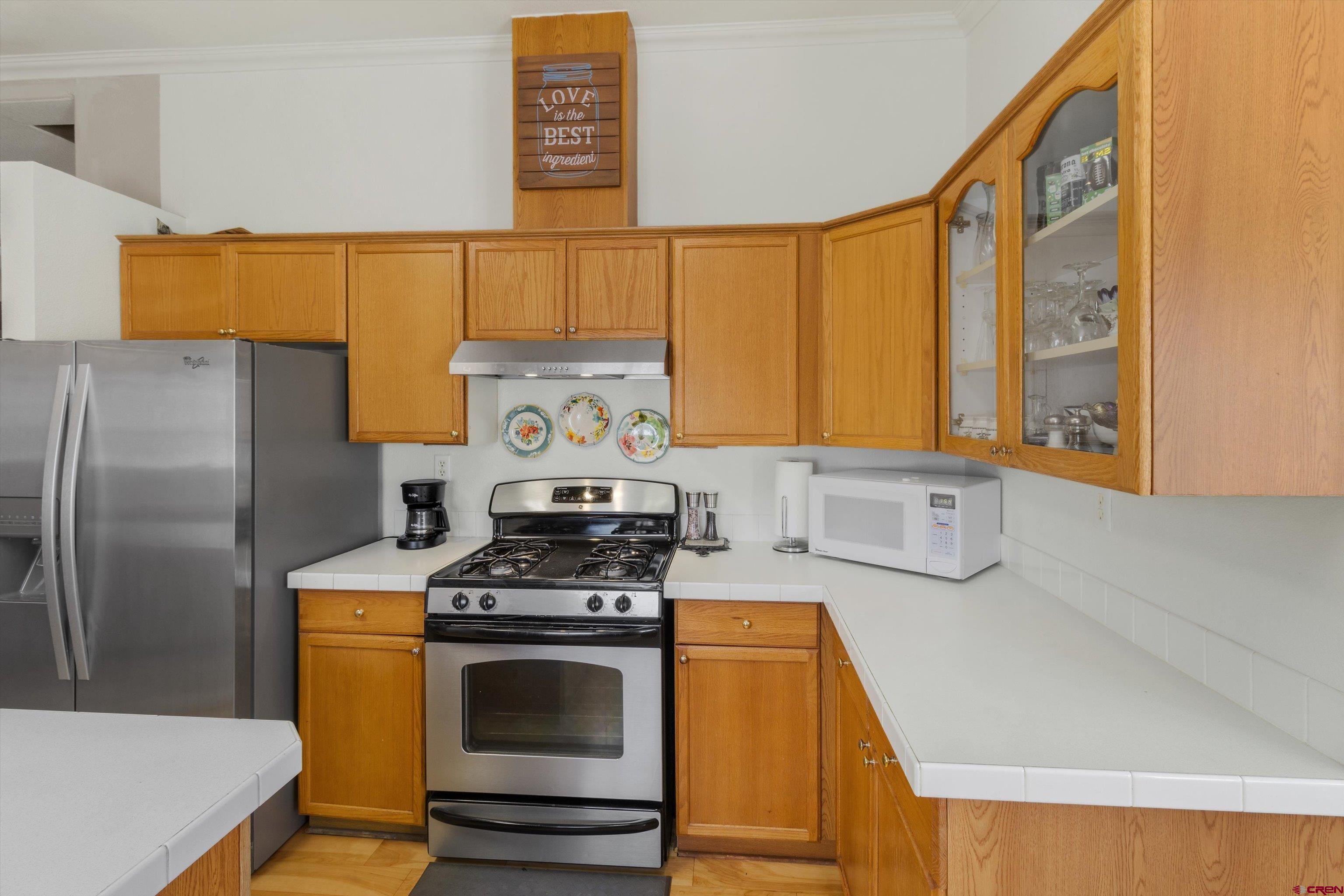 34 Silverview Court Durango, CO 81303 - Photo 12 of 29 a kitchen with a stove a refrigerator and a sink