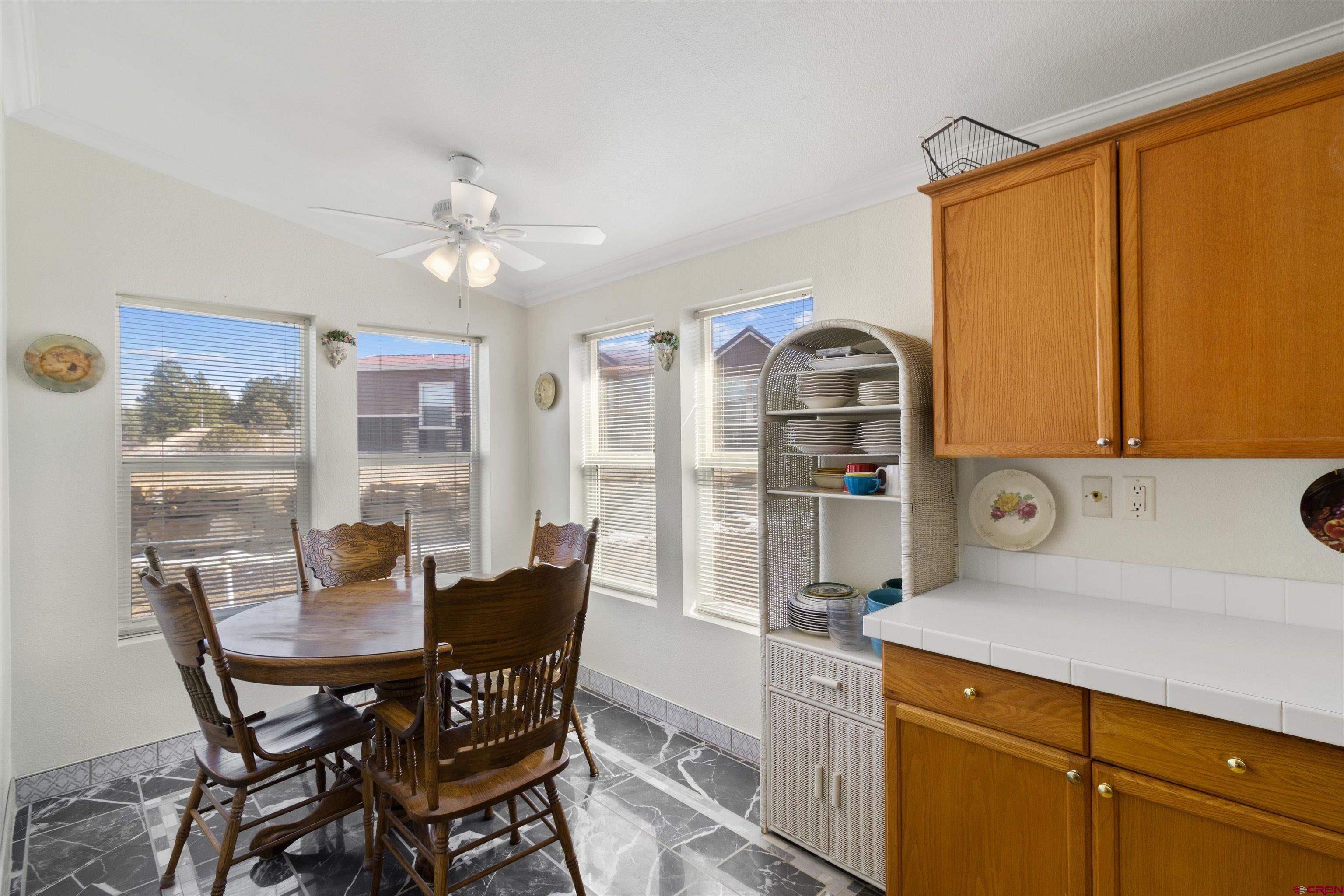34 Silverview Court Durango, CO 81303 - Photo 13 of 29 a view of a dining room with furniture window and outside view