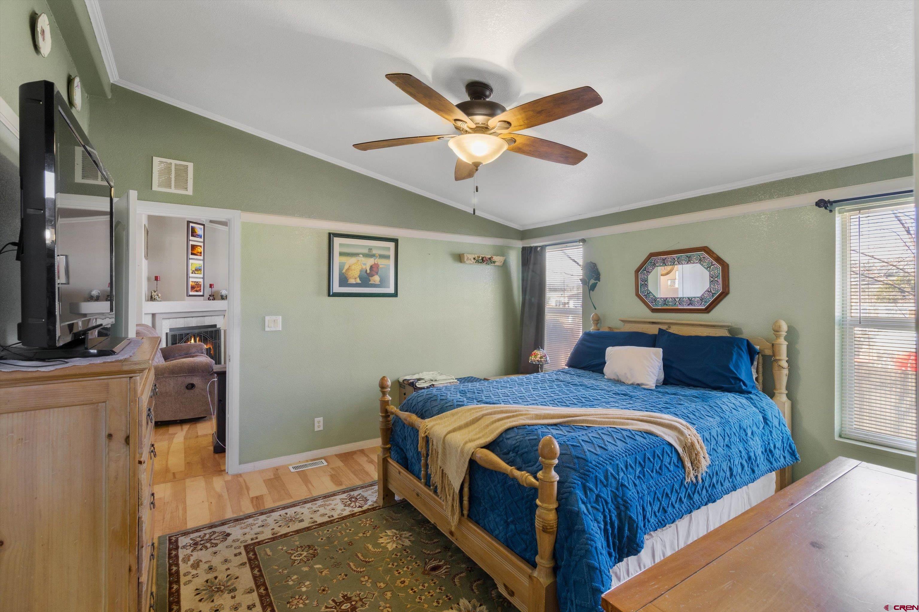 34 Silverview Court Durango, CO 81303 - Photo 18 of 29 a bed room with a bed and a chandelier
