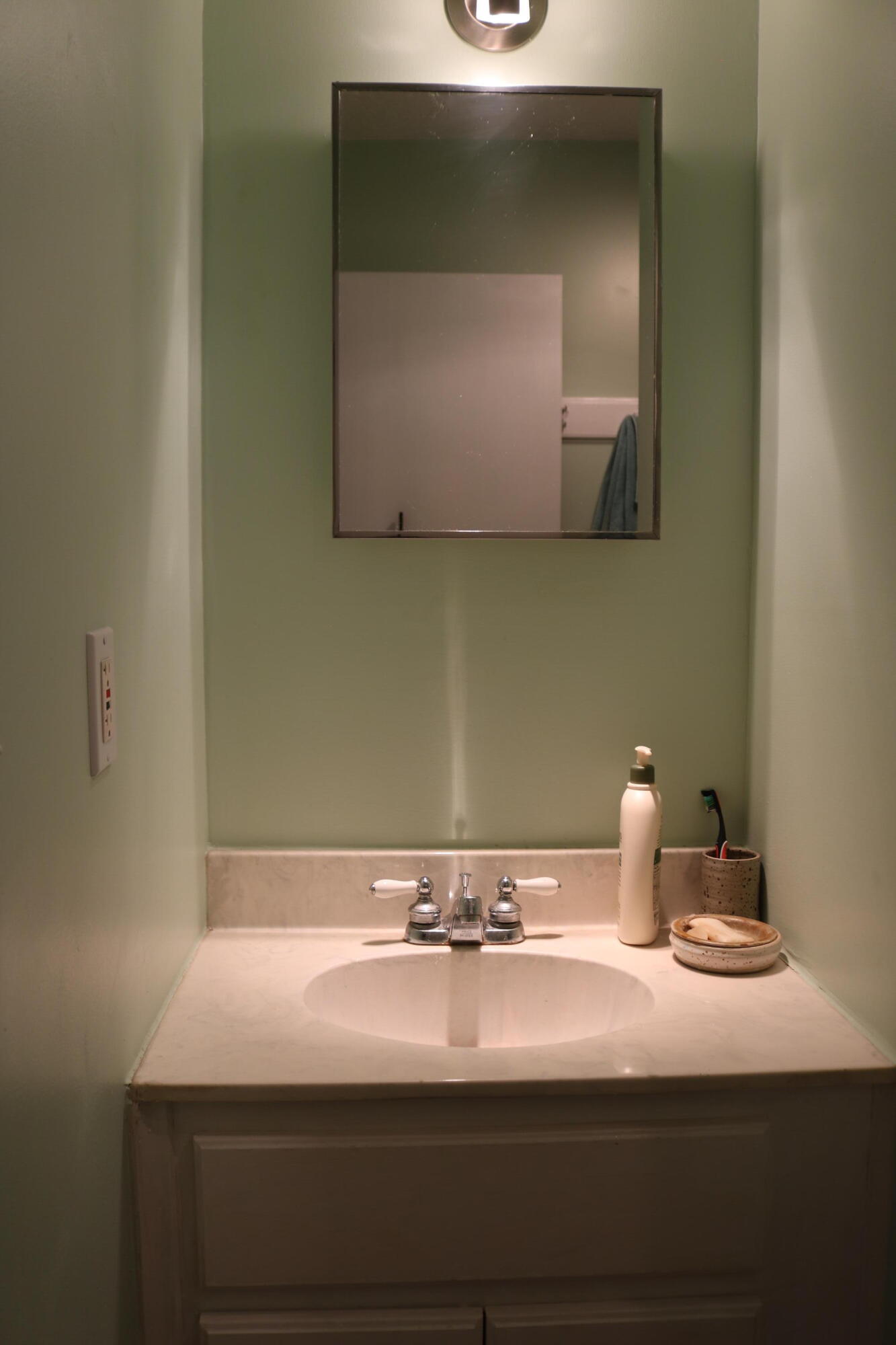 265 Howell Bluff Road Ponce de Leon, FL 32455 - Photo 16 of 18 a bathroom with a sink and a mirror