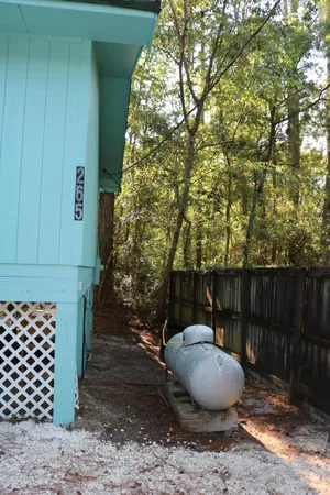 a view of a backyard of the house