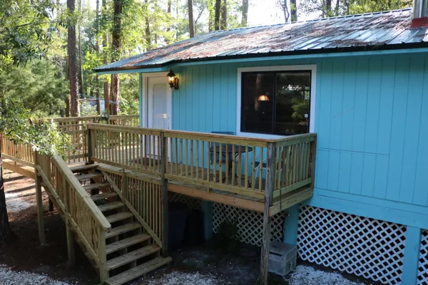 a view of a wooden deck with a bench