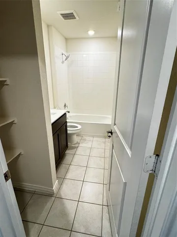 a bathroom with a sink a toilet and a shower