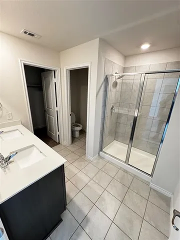 a bathroom with a sink a mirror and a shower