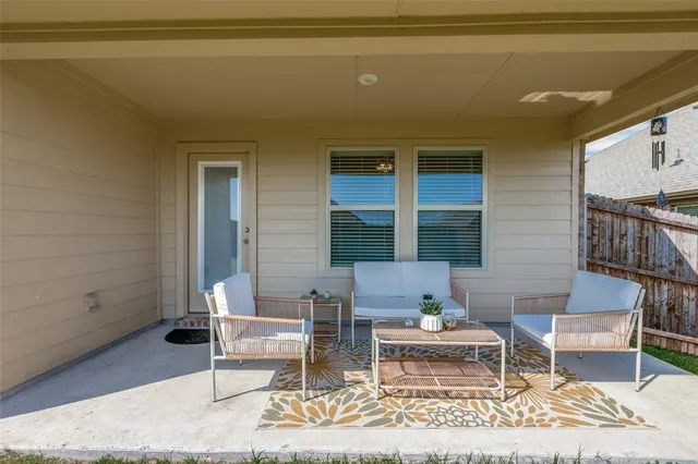 a living room with furniture and a rug
