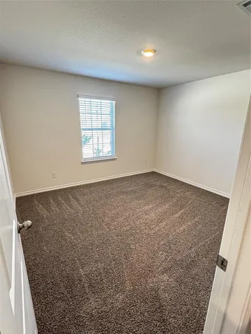 a view of wooden floor in an empty room
