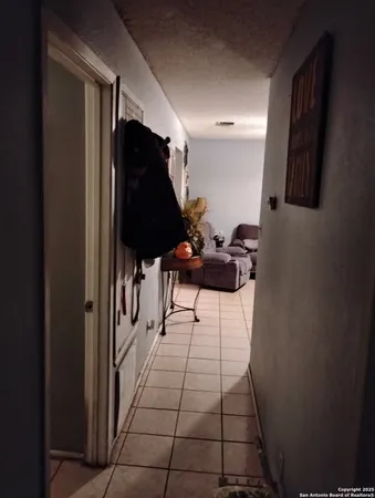 a view of a hallway with seating area