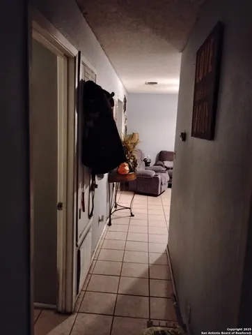 a view of a hallway with seating area