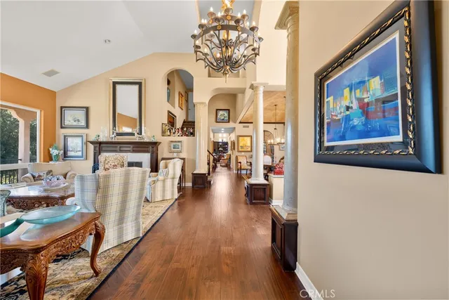 a view of a living room with furniture and a fireplace