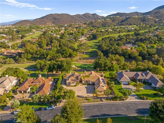 an aerial view of residential houses and outdoor space