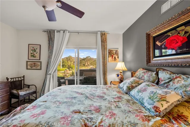a view of entryway bedroom and hall with wooden floor