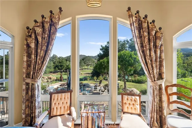 a living room with furniture fireplace and rug
