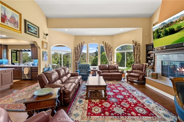 a very nice looking living room with furniture and a large window