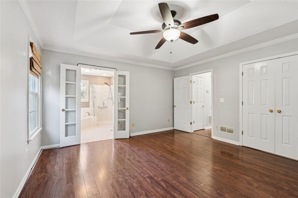 2470 Jakin Way Suwanee, GA 30024 - Photo 24 of 64 a view of an empty room with wooden floor