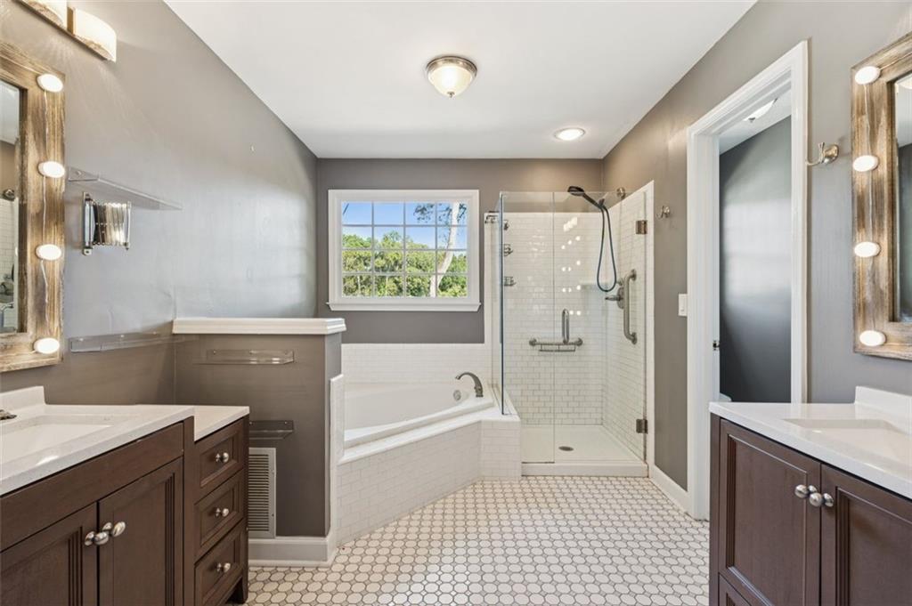 2470 Jakin Way Suwanee, GA 30024 - Photo 25 of 64 a bathroom with a granite countertop sink a toilet a shower and a mirror