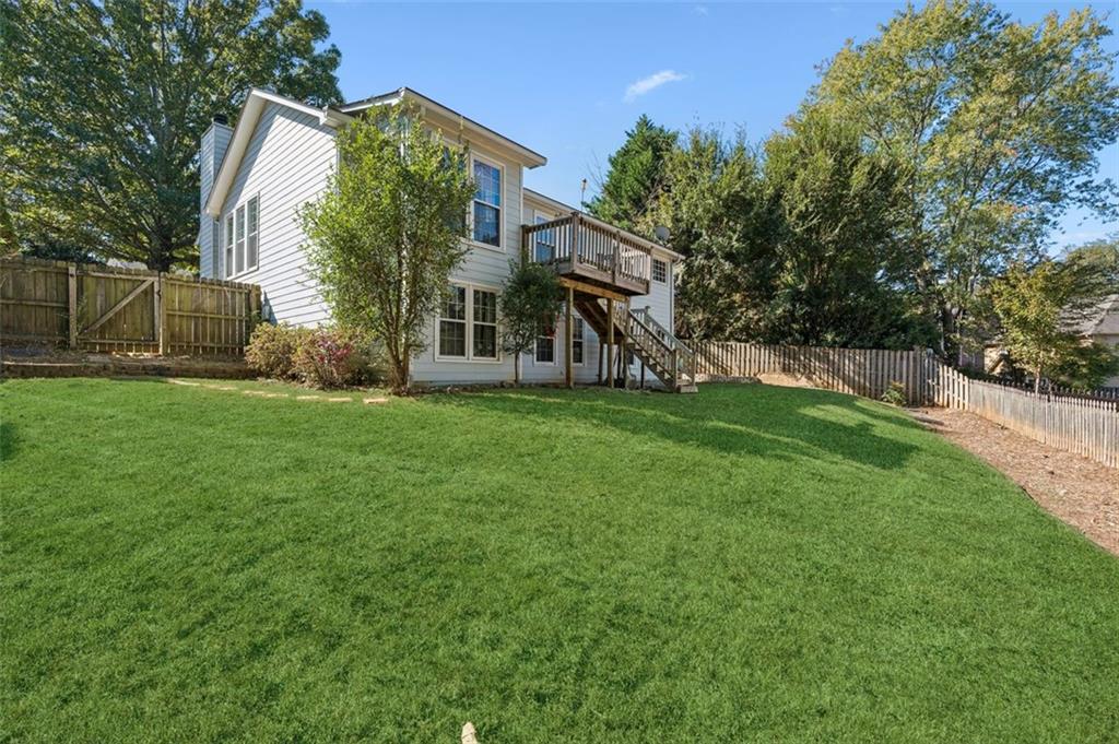 2470 Jakin Way Suwanee, GA 30024 - Photo 51 of 64 a view of a house with a yard