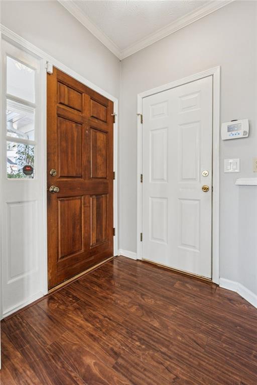 2470 Jakin Way Suwanee, GA 30024 - Photo 7 of 64 a view of empty room with wooden floor and cabinet