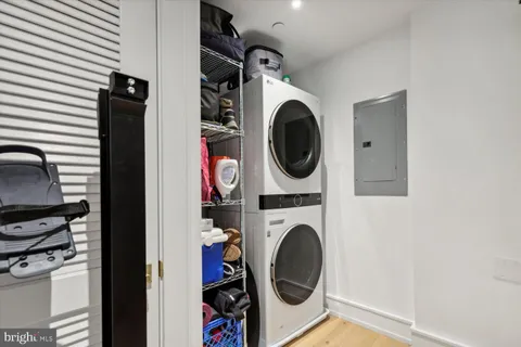 a view of a storage and utility room with washer and dryer