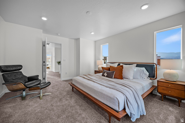 2202 Wolverine Way, Unit 2529 Washington, UT 84780 - Photo 22 of 27 Spacious bedroom featuring neutral carpeting, recessed ceiling lighting, and multiple windows providing natural light