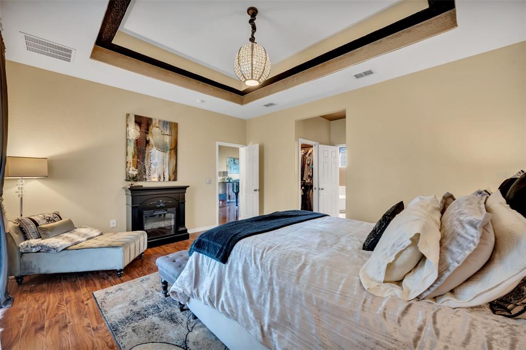 4946 Northeast 124th Road Oxford, FL 34484 - Photo 27 of 69 a bedroom with a bed and a couch