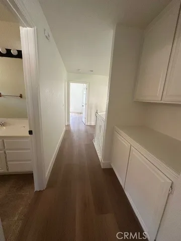 a view of an empty room and a window