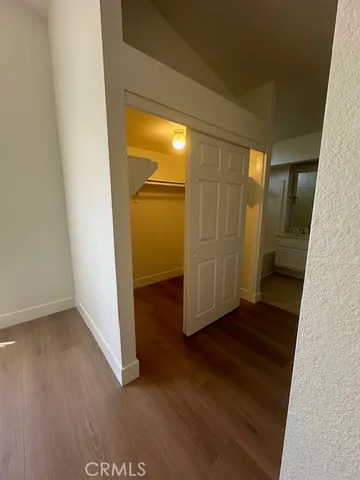 a view of a livingroom with a ceiling fan and window
