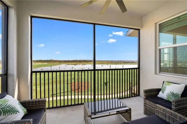 a view of a balcony with furniture